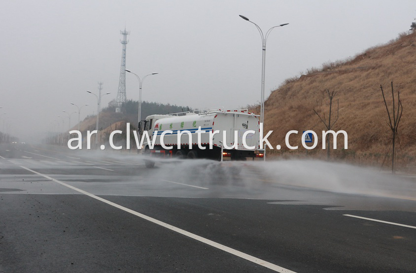 street water spray truck in action 1